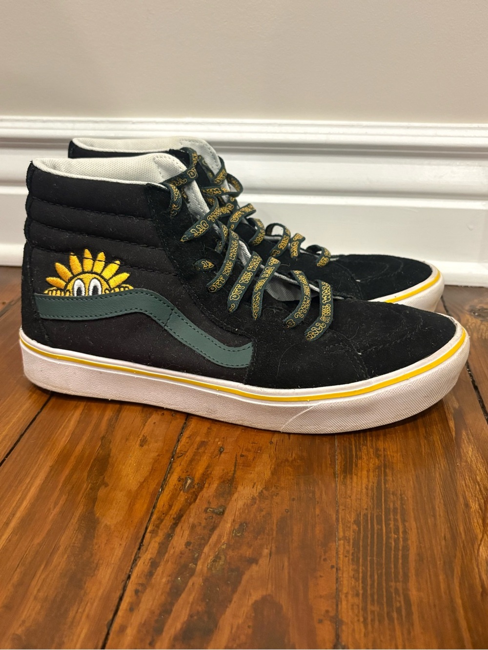 Vans Black High-Top Sneakers with Yellow Embroidered Sunflower Detail